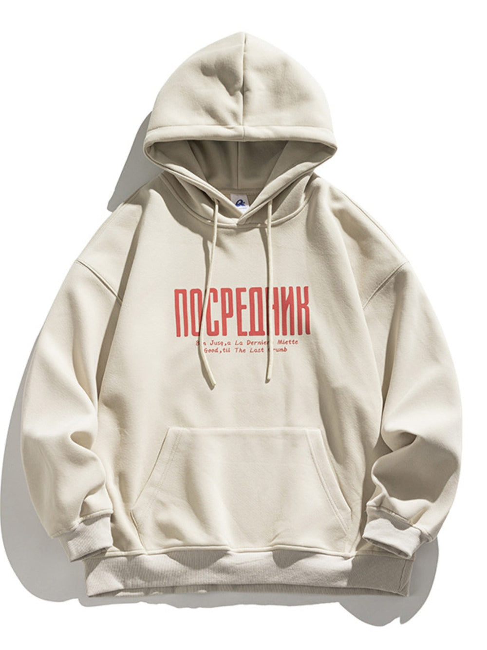Beige hoodie with red text on a white background